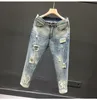 Jeans di lusso estivi e alla moda stile harajuku per uomo con fori Jeans casual da uomo piccoli piedi con fori Pantaloni vintage mendicante 52ov #