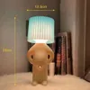 Nuova lampada da tavolo creativa Claeted Naughty Boy LED unica pieghe lettura illuminazione camera da letto comodino luce notturna regalo per bambini