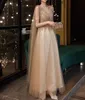 Champagne Gold Evening Dres avec Cape A Line Sexy Sexy V-Cold A-Line Shiny Luxury Luxury Beading Châle Formeal Celebrity Prom Robes New W0yl # #