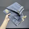 Jeans da uomo Nuova Primavera / Estate Moda coreana Uomo Jeans di lusso Tuta Elastico Stretch Articoli Lavaggio Abbigliamento Borsa a cono Pantaloni da joggingL2403