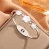 Fashionable Imitation White Beige Three Leaf Clover Open for Women, and Versatile Gold Non Fading Bracelet Jewelry