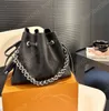 NOUVELLE Mode classique de luxe marque française Designer de luxe pour femmes Sac seau évidé Sac à main pour femme Sac à bandoulière Sac à main à bandoulière Portefeuille 23 cm * 19 cm