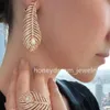 Boucle d'oreille en argent Plume de paon plumes de paon logo de créateur luxe bijoux fins diamant pavé chevalière anneaux de mariage pour couple créatif grand anneau