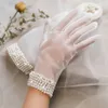 Gants de mariage de perle de mariée