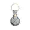 Luxurys designers fodral för Apple Airtags läderbrun blommakanianimation Key Ringkedjband Dock Bag Pendant 16 Styles