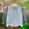 Topdesigner blauw en wit gestreept ademend damesshirt met ronde hals en kleine ronde hals voor lente 2024