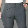 Pantalones para hombres Moda Color sólido Bolsillos con cremallera Pantalones de negocios Ropa 2024 Primavera Verano Suelto Cintura alta Casual