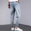 Frayed Tassel rippade jeans för man låg stigande flugfickor smala denim mäns byxor tidigt höst passar casual mens designer kläder z5rw#