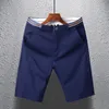 Moda Color sólido Bolsillos empalmados Pantalones cortos rectos casuales Ropa para hombre Verano Suelto Cintura alta Allmatch Rodilla 240329