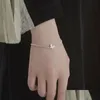 Identifiering 925 Sier Charm Armband för kvinnor Nya trendiga eleganta fjäril Zirkonpar smycken Drop Leverans Armband Dhjno