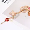 Kreatywny kryształowy koniczyna koniczyna kluczyka kluczyka kluczyka Women Cute Flower Blak -Brelkain Bag wiszka
