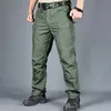 Calças de carga táticas dos homens calças de combate do exército calças militares múltiplos bolsos trabalho caminhadas casuais calças masculinas plus size 6xl 240321