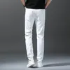 2023年秋の新しい白いメンズジーンズストレートスリムソリッドカラーカジュアルデニムズボネル