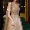 Champagne Gold Evening Dres avec Cape A Line Sexy Sexy V-Cold A-Line Shiny Luxury Luxury Beading Châle Formeal Celebrity Prom Robes New W0yl # #