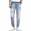 потертые рваные джинсы с кисточками для мужчин с низкой посадкой и карманами для мух Тонкие джинсовые мужские брюки Ранняя осень Fit Повседневная мужская дизайнерская одежда Z5rw #