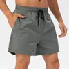 Pantaloncini da uomo estivi Capris sportivi larghi con fodera elastica traspirante e corsa casual fitness ad asciugatura rapida