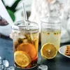 Bicchieri da vino Tazza da caffè in vetro trasparente creativo nordico Tazza da acqua per tè e latte resistente al calore con coperchio e tazza da tè per ufficio in cannuccia