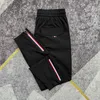 Summer thin ice silk breathable air conditioning pants for mens slim fitting 100 zipper sports leggings milk silk quick drying pants