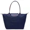 2024 Fashionabla och mångsidiga dumpling Classic Brand Womens New Foldble Waterproof Nylon Handväska för kvinnor