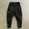 Pantaloni da uomo corda per i piedi solida per uomo Hop nove punti casual multitasche sottili streetwear pantaloni maschili Ropa Hombre