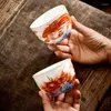 Fincan tabakları 2pcs Yüksek kaliteli seramik çay fincanı emaye renk ejderha ve Phoenix desen çay bardağı butik bireysel tek set malzemeleri