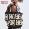 Frühling und Sommer neue Großmutter-Gitter-Farbblock-Spleißen-Gras-gewebte Tasche mit ausgehöhlter Handtasche mit großem Fassungsvermögen für Damenmode-Einkaufstasche