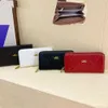 Loja feminina bolsa liquidação nova carteira feminina longa com zíper grande capacidade bolsa de mão simples e elegante telefone móvel bordado