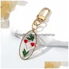 Keychains Lanyards Oval Pressed Real Torked Flower Daisy Pendant Key Chain Metal Plated Rotationable Ring Smycken R231003 Drop Deliv Dhtri