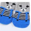 Vêtements de chien 4pcs / set chaussettes pour animaux de compagnie anti-dérapant imprimé chats produits de protection de chiot tricoté chaud intérieur portant chat couleur aléatoire