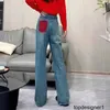 Projektant Nanyou Wysoka jakość CE Nowa czerwona kieszeń dla kobiet Pluszowa materiał Pluszowa tkanina prosta smukłe dżinsowe spodnie IN8C
