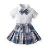 2st Kids Girls Japanese Style Plaid kjol kläder Kort ärm Bowknot Shirt Topps Pleated Mini Kjol Barnskolouniformer M5VW#