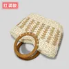 Spring and summer handmade woven wooden handle grass woven bag for women's forest style seaside vacation handbag, niche striped woven bag