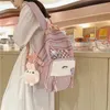 女性用バックパックバックパックボルサハンドキャリー荷物袋2024韓国語バージョンソリッドカラー大容量バッグトレンドカワイイ