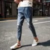Jeansy małe stóp jesień żebrakowe spodnie złamane dziewięć podzielonych spodni męskie dziewięć spodni Slim Fit ciasne legginsy Student Koreańskie spodnie w stylu
