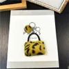 Keychains Lanyards Plush Leopard Pattern Wallet Keychain Womens Cartoon Coin Wallet with Keychain Mini Earphone Bag Decorative Gift J240330