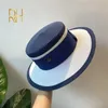 Hepburn Style de célébrité française parfum couleur correspondant haut femme parasol protection solaire vacances voyage plat chapeau de paille 240320