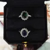 2024 TOP SELD WEDGNE RINGS FACHING JEWLLY 925 Sterling Silver Oval Cut Blue Sapphire Emerald Diamond Party Women Flower Princess Ring Mother Day 선물