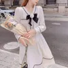 Arbetsklänningar kvinnliga kostymer hösten fransk nisch kort vit kappjacka svart a-line kjol tvådelar set kvinnor