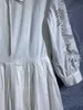 Europäisches und amerikanisches Designerkleid mit ausgehöhlter Stickerei, Stehkragen und langem Rock mit Laternenärmeln
