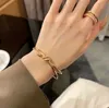 Designer Crowd Knot Armband för kvinnor Ljus lyx 18K Rose Gold Cross Diamond Free