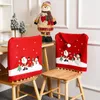 椅子はレッドクリスマスハットカバークリスマスサンタクロースの装飾のためのパーティーデコレーションホームテーブルディナーバッククロス