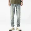 Jeans da uomo Autunno Nuovi pantaloni da uomo a righe laterali Pantaloni lunghi elasticizzati in cotone Abbigliamento casual da uomo Jeans quotidiano J240328