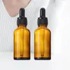 収納ボトル2pcs 10ml 15ml 20ml 30mlトラベルコスメティックスアンバードロッパーガラスかわいいエッセンシャルオイル