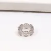 Lüks Orijinal Tasarımcı Markalı Logo Gravür AAA+ 7 Moissanit Çöp Hollow Ring 18k Beyaz Altın Aşk Yüzükleri Kadın Kız Erkek Erkek Erkek Düğün Nişan Takı USA BOYUT 6 7 8