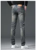 Primavera/Estate Nuovi Jeans alla moda europea per uomo e gioventù Pantaloni casual in cotone elastico slim fit edizione coreana