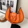 2024 Handväska Ladies Luxury Bags Designer Mini Bag Leisure Travel Ribbon Tote Bag Läder Material Fashion Shoulder Bag Wallet Axillary Pouch A19