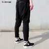 Pantalons pour hommes personnalisés été hommes maigre slim longueur pantalon décontracté mâle hiphop hommes harem pieds noir romant rue