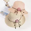 Chapeaux à large bord Chapeau de soleil décontracté Bow Fleurs Chapeau de paille Crème solaire Plage Élégant Doux Mode Extérieur Pliable Femmes Seau