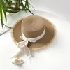 Breda randen hattar 2024 Flat Top Straw Hat For Women's Bow Tie Ribbon Leisure Summer Sunscreen Fashion Anti-UV Beach Boater gåvor