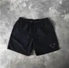 Homem designer homens shorts calças de praia shorts verão nadar curto na altura do joelho hip hop high street treinamento esportivo calças de praia homens mulheres algodão casal cintura elástica